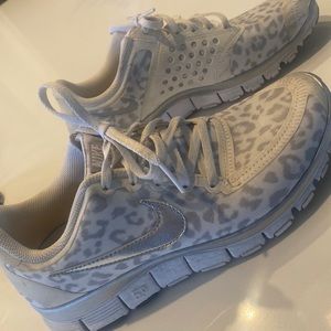 Grey/silver Nike leopard shoes.
